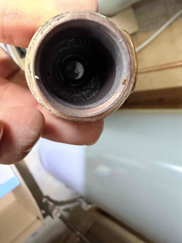 Replaced failed backflow preventer and pressure reducing valve (PRV) in customer's plumbing system. Inspection revealed significant mineral buildup and sediment in the pipes, which was contributing to system pressure issues. New components were installed and system operation was verified with proper pressure readings.