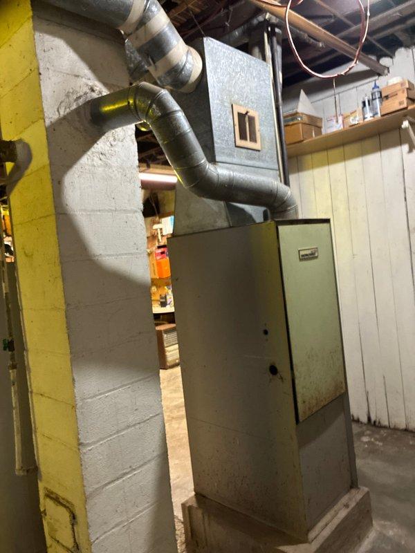 Conducted estimate for replacement of severely aged furnace (approximately 60 years old) which is providing minimal heat output. Current unit located in basement with good accessibility shows significant wear but remains operational. Ductwork system appears intact with proper insulation. Property is tenant-occupied with owner's son available for consultation regarding replacement options.