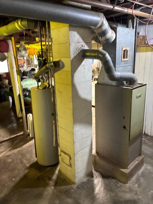 Conducted estimate for replacement of severely aged furnace (approximately 60 years old) which is providing minimal heat output. Current unit located in basement with good accessibility shows significant wear but remains operational. Ductwork system appears intact with proper insulation. Property is tenant-occupied with owner's son available for consultation regarding replacement options.