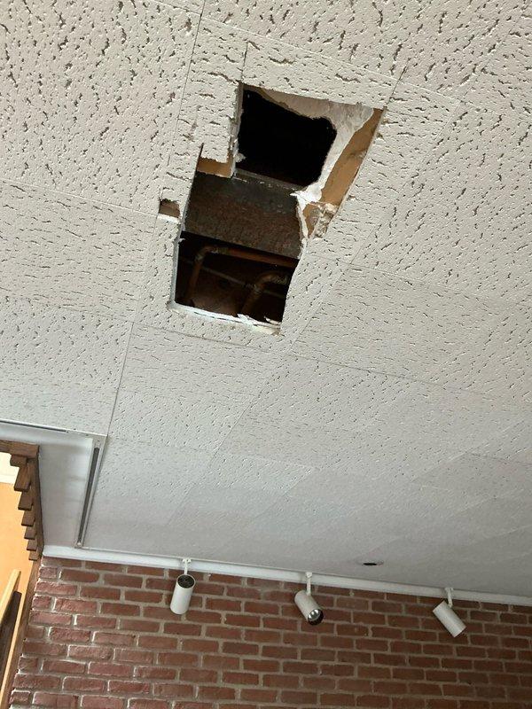 Conducted estimate for installation of Unico HVAC system in the older section of residence currently lacking air conditioning. Inspection revealed electrical panel with adequate service capacity, though significant water damage was observed on adjacent walls near PVC piping. Ceiling assessment identified compromised acoustic tiles with visible ductwork access, which will require repair during system installation.