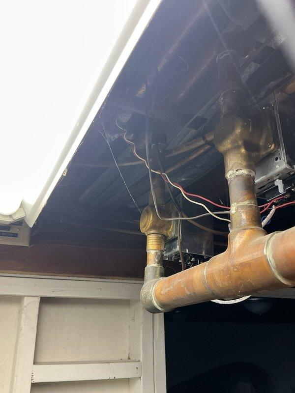 Responded to service call for communication failure between boiler and thermostat. Inspected existing Honeywell Home control module and identified faulty wiring connections at the interface. Restored proper communication by repairing electrical connections between the control board and thermostat system.