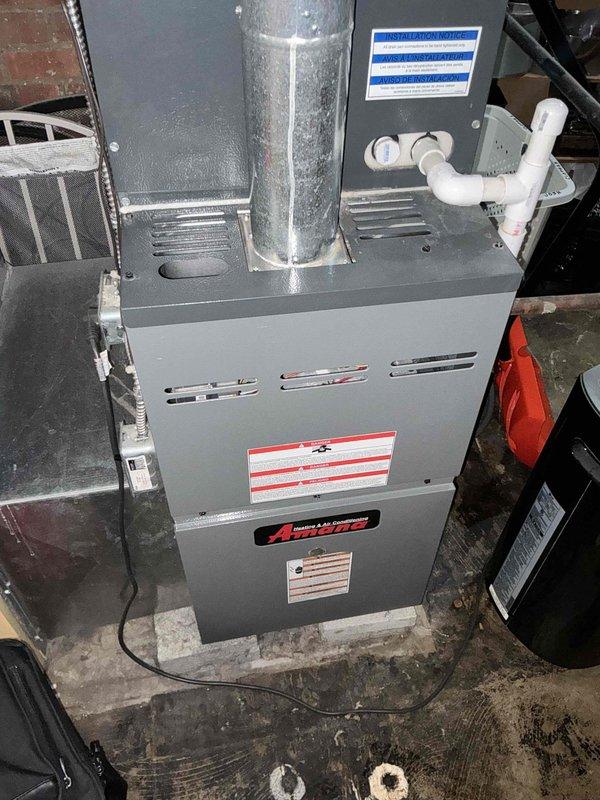 Performed assessment for insurance claim on forced air HVAC system with condenser damaged by fallen icicle. Documented existing Amana furnace installation with PVC condensate drainage system and took measurements for replacement unit specifications. Created dimensional sketch with key measurements (16", 26", 30", 17", 84") to ensure proper sizing of replacement equipment.