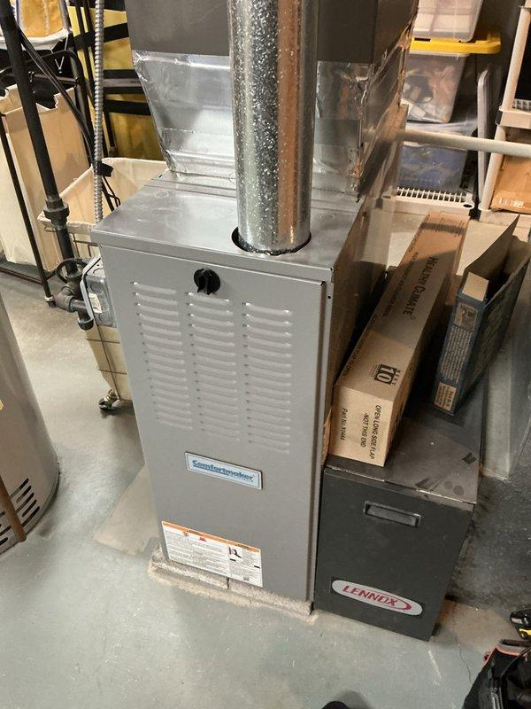 Responded to noise complaint from Comfortmaker furnace. Inspected system including ductwork, Aprilaire controller, and adjacent Lennox unit. Identified loose connection at the furnace-to-ductwork junction where metal tape had deteriorated, causing vibration noise during operation. Resealed connection with appropriate HVAC metallic tape to eliminate noise issue.