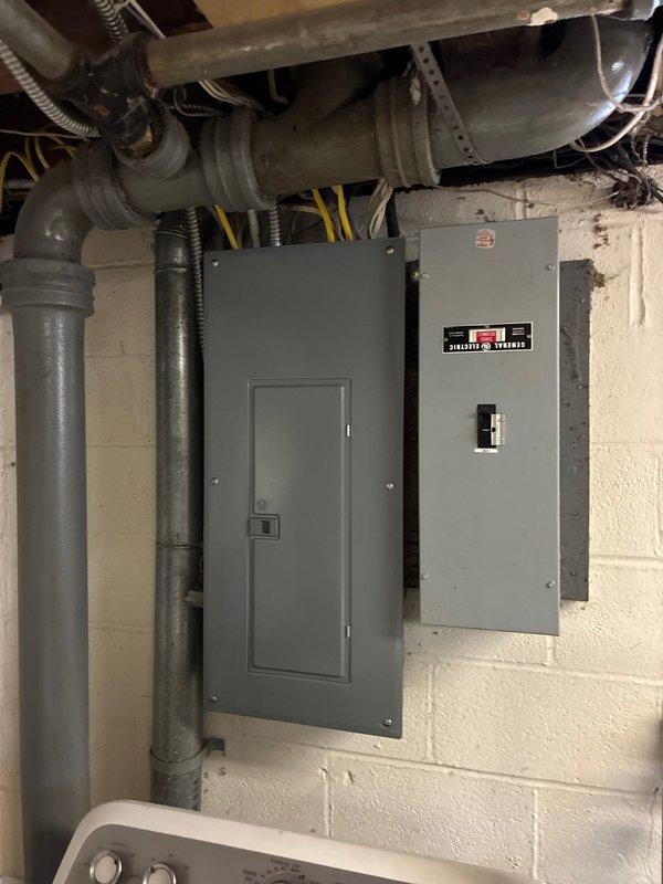 Responded to no-heat service call. Inspected electrical panels and connections in utility area. Examined ventilation ductwork and copper piping showing oxidation near furnace unit. Recommended complete system replacement due to age and condition of components.