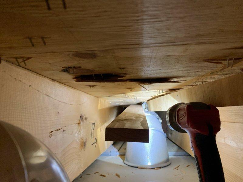 Performed inspection of customer-reported uneven heating issue and disconnected piping in crawlspace. Identified water damage on wooden ceiling joists near HVAC ductwork. Reconnected loose duct connection and verified system operation to resolve uneven heating distribution to upper floor.