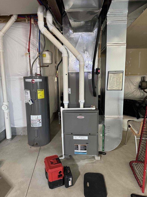 Performed standard heating system tune-up on Lennox furnace unit. Inspection revealed significant rust and corrosion on the evaporator coil's copper tubes and connections. Documented condition with photos for customer review and discussed maintenance plan options.