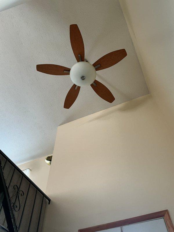 Responded to electrical service call after tenant experienced power issue following a circuit overload. Inspected ceiling fan in entryway that failed to operate after breakers were reset. Removed and tested light switch, confirming proper voltage and replacing faulty switch. Verified proper operation of the 5-blade ceiling fan fixture before completing service.