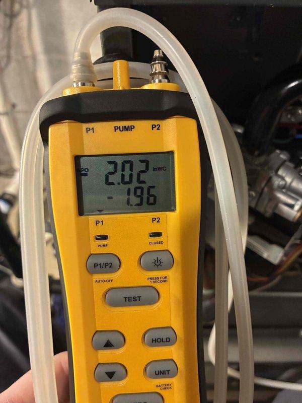 Responded to follow-up service call for intermittent heating issue. Diagnostic testing with UEi G2 Phoenix Pro-DL379 multimeter revealed abnormal amperage readings, while manometer measurements showed gas pressure at 202 inWC with -1.96 differential. Adjusted pressure settings and verified proper ignition sequence, resolving the cycling problem previously reported.