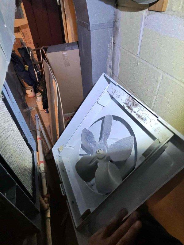 Responded to no-heat service call following previous technician visit. Inspected air handler system in basement utility area, noting dust accumulation on fan unit. Examination of blower motor assembly revealed signs of wear and possible mechanical issues. Serviced equipment to restore proper heating function.