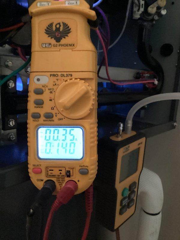 Performed scheduled monthly heating maintenance on HVAC system. Conducted electrical diagnostics using UEI G2 Phoenix multimeter showing readings of 00.35/0.140, and measured system parameters with TM52 meter indicating 3.78. All components tested within operational parameters.