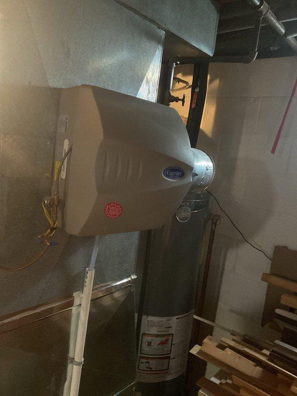 Performed scheduled heating tune-up on Carrier furnace system located in basement utility room. Inspected all components including ductwork connections, PVC venting pipes, and electrical connections for proper operation. System was found to be functioning correctly with no issues requiring repair.