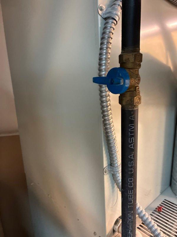 Conducted comprehensive assessment of existing HVAC system showing end-of-life conditions with complete heat failure. Evaluated current installation configuration including water heater connections and ductwork placement for replacement feasibility. Documented plumbing components and shut-off valve positioning to ensure proper system integration in replacement proposal.