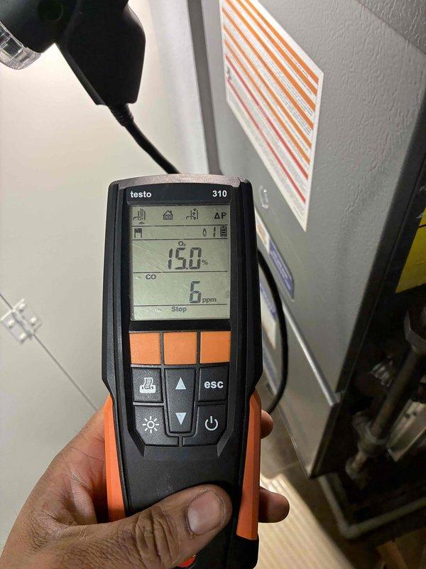Performed heating maintenance including combustion analysis with Testo 310 showing 15.0% O2 and 6ppm CO readings. Inspected blower motor assembly and wiring connections. Verified customer's filter dimensions were incorrect and assessed non-functioning humidifier causing excessive dryness in home.