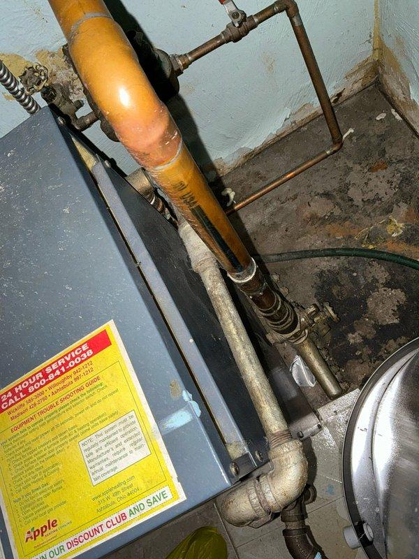Conducted comprehensive assessment of existing water boiler system and provided three-tier replacement options (Good/Better/Best) for conversion to gas HVAC system. Documented current installation including gas line with visible corrosion, associated plumbing connections, and verified electrical panel configuration with dedicated circuit breakers for HVAC equipment. Presented customer with energy efficiency options ranging from 80% to 96% AFUE for heating and 13.4 to 16 SEER for cooling capacity.
