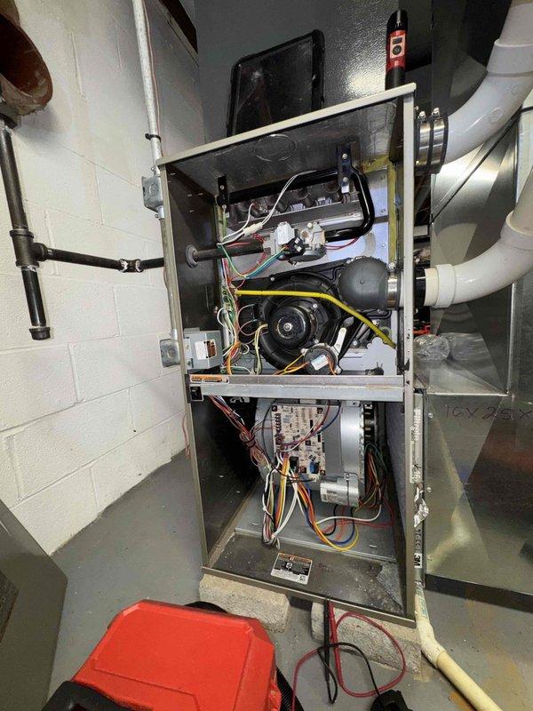 Performed scheduled monthly heating maintenance service on furnace unit. Removed access panels to inspect internal components including blower motor assembly, circuit boards, and electrical connections. All components were found to be in normal operating condition with no visible damage or abnormalities.