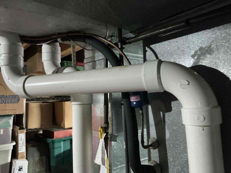 Conducted comprehensive assessment of existing HVAC system and hot water tank for potential replacement. Evaluated basement utility area with focus on current ventilation infrastructure, including metal ductwork with 90-degree bend penetrating cinder block wall and adjacent copper piping showing signs of corrosion. Presented customer with multiple furnace options as well as combined furnace and hot water tank replacement solutions.