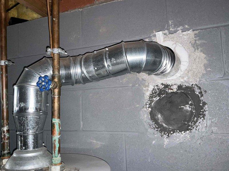 Conducted comprehensive assessment of existing HVAC system and hot water tank for potential replacement. Evaluated basement utility area with focus on current ventilation infrastructure, including metal ductwork with 90-degree bend penetrating cinder block wall and adjacent copper piping showing signs of corrosion. Presented customer with multiple furnace options as well as combined furnace and hot water tank replacement solutions.