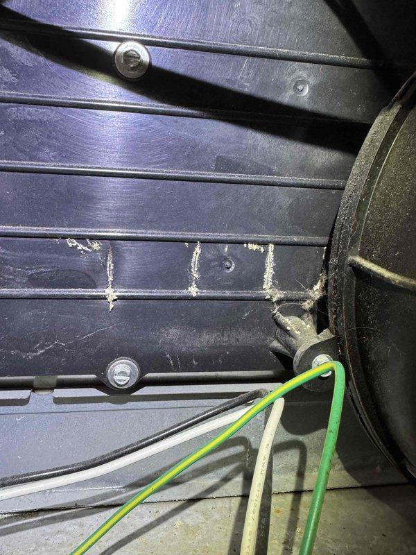 Responded to no-heat service call for aging furnace. Inspection of heat exchanger revealed accumulated dust and residue on critical components. Performed maintenance cleaning of heat exchanger surfaces, inspected fan assembly and electrical connections, restoring proper operation of heating system.