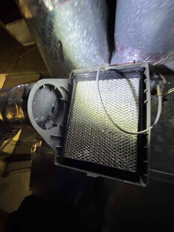 Responded to service call for leaking humidifier. Previous technician was unable to access unit due to space constraints. Water supply was shut off to prevent further leakage. Inspected thermostat system and filter housing, took documentation photos of components for reference.