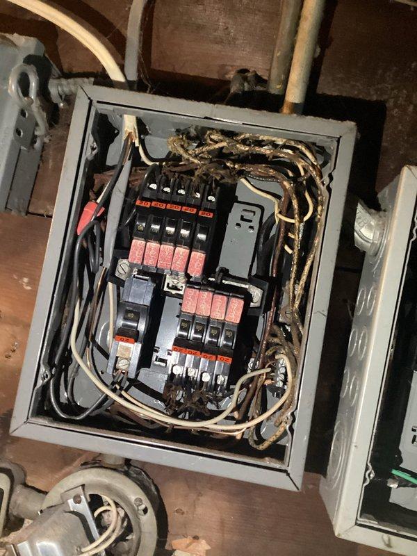 Conducted post-electrical inspection of residential panel with outdated cloth-covered wiring and deteriorated insulation. Documented existing conditions including disorganized wiring configuration and aging components for panel replacement quote. Photos taken of panel interior and outlet conditions for comprehensive assessment.