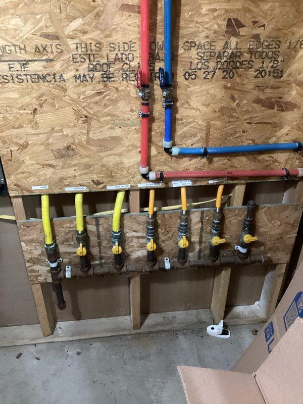 Completed scheduled maintenance on wall-mounted tankless water heater system. Inspected all plumbing connections including hot/cold water lines, gas supply lines with shutoff valves, and PVC venting. Verified proper operation of unit and control panel functionality.