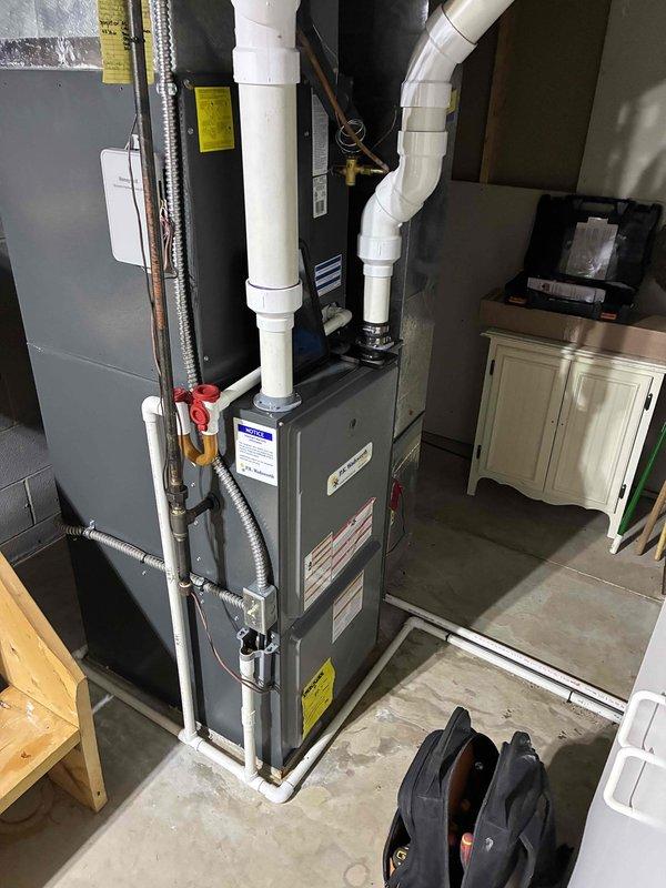 Performed scheduled heating system maintenance on a gas furnace with PVC venting system. Tested supply air temperature, which registered at 122°F, confirming proper operation. All components inspected, connections verified secure, and system functioning within normal parameters.