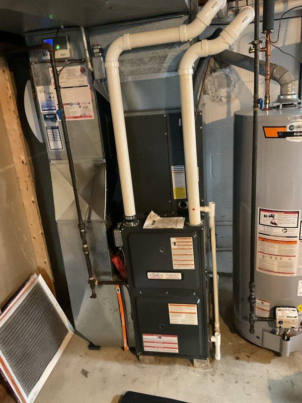 Performed routine heating maintenance on residential furnace system. Inspected electrical components including circuit board and wiring connections, verified proper installation of PVC exhaust venting, and examined overall system condition. All components found to be in good working order with no issues identified.