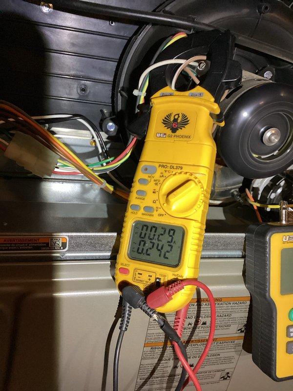 Performed routine heating tune-up on 3-year-old furnace system including electrical component testing with clamp meter to verify proper amperage readings. Investigated customer's concern about potential gas leak near condensate drain; inspected internal components and connections for any signs of leakage. System was found to be operating within normal parameters with all safety devices functioning correctly.