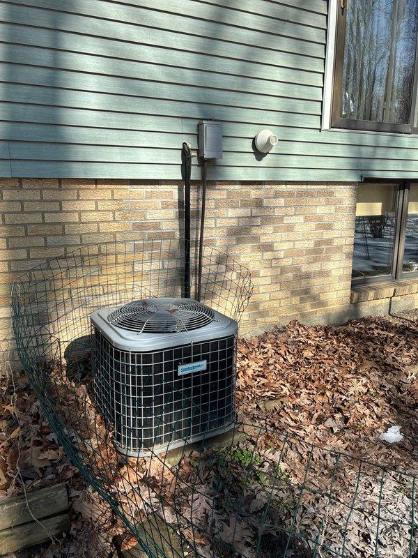 Conducted comprehensive assessment of existing HVAC equipment, including basement furnace unit and primary Comfort Maker system. Evaluated two outdoor condensing units (Goodman model mounted on concrete pad and second unit positioned alongside residence with protective fencing) to prepare replacement options for complete system upgrade.