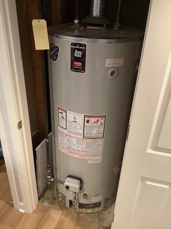 Responded to service call regarding water heater leak. Inspected Bradford White residential water heater and identified leak source at top connection points. Tightened fittings to resolve the issue and verified proper operation of unit and venting system.