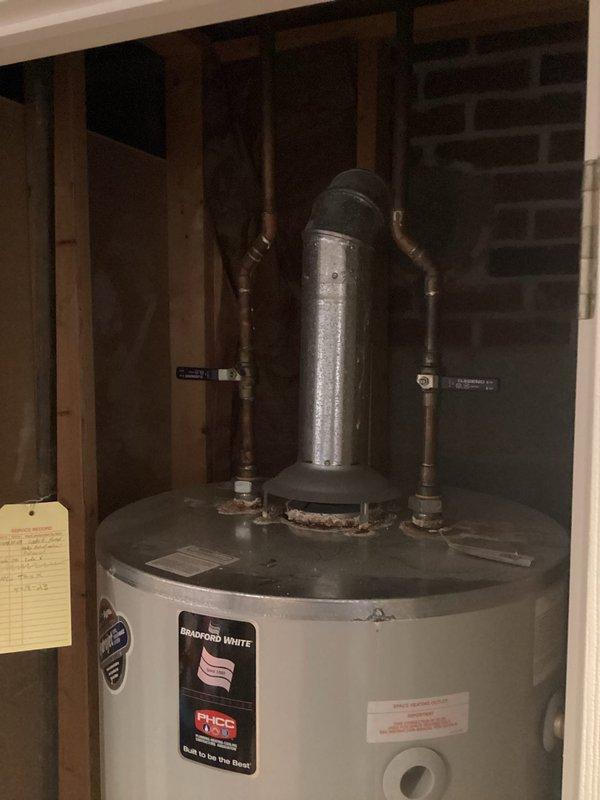 Responded to service call regarding water heater leak. Inspected Bradford White residential water heater and identified leak source at top connection points. Tightened fittings to resolve the issue and verified proper operation of unit and venting system.