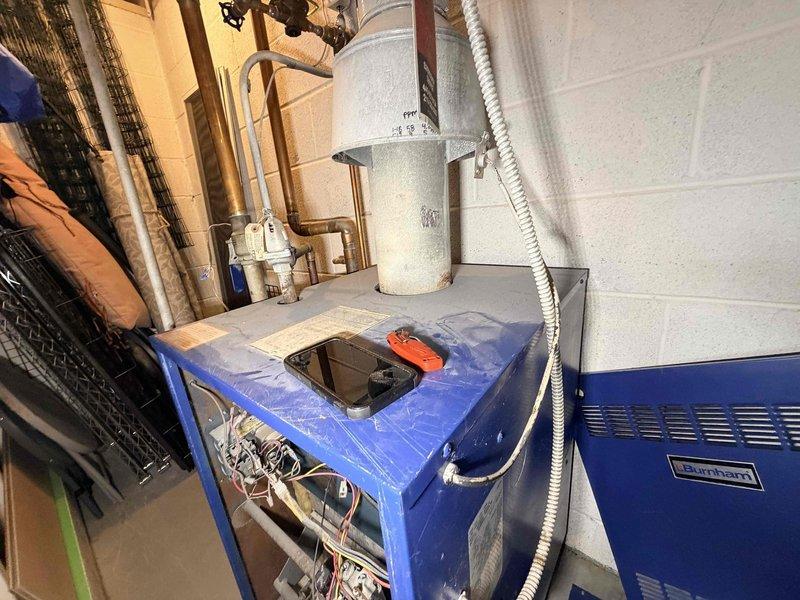 Performed scheduled boiler maintenance and inspection. Found moderate dust accumulation on heat exchanger components and visible rust on exhaust piping. Evaluated existing thermostat as requested by customer and confirmed replacement is recommended due to inconsistent temperature regulation.