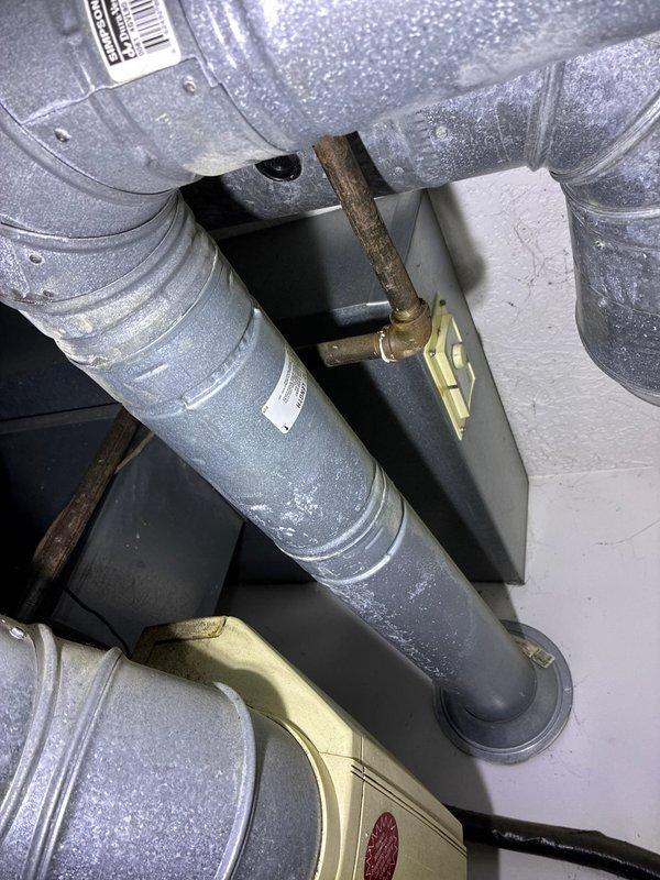 Replaced non-functional garage heating unit with new system, including installation of properly sealed metal ductwork with appropriate elbow joints and mounting brackets. Connected new refrigerant lines with proper insulation and installed necessary plumbing components to ensure optimal system performance.
