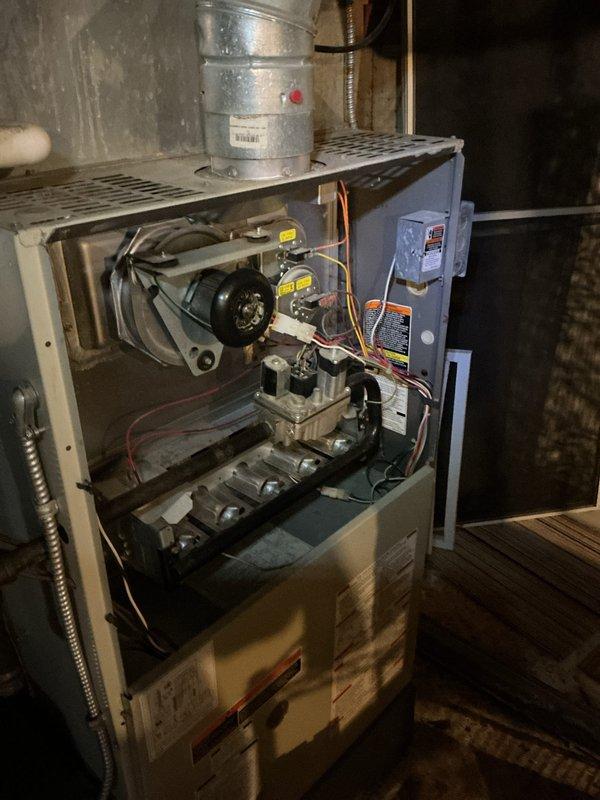 Performed comprehensive tune-up service on two aging HVAC units (10+ years old): a furnace and boiler. Inspected furnace interior components including blower motor assembly, heat exchangers, control board, gas valve, and safety switches; noted some dust accumulation but all systems functioning within acceptable parameters. Documented condition with detailed photos for service record.