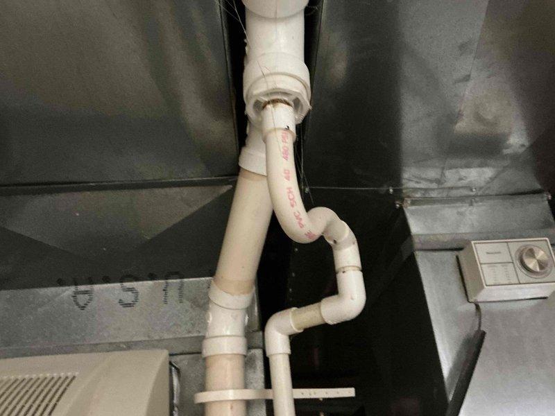 Conducted comprehensive HVAC system replacement consultation, presenting three Goodman equipment options ranging from 13.4-16 SEER cooling efficiency and 80-96% AFUE heating efficiency. Documented existing plumbing configuration and identified significant water damage/mineral buildup near the utility area that will need addressing during installation.