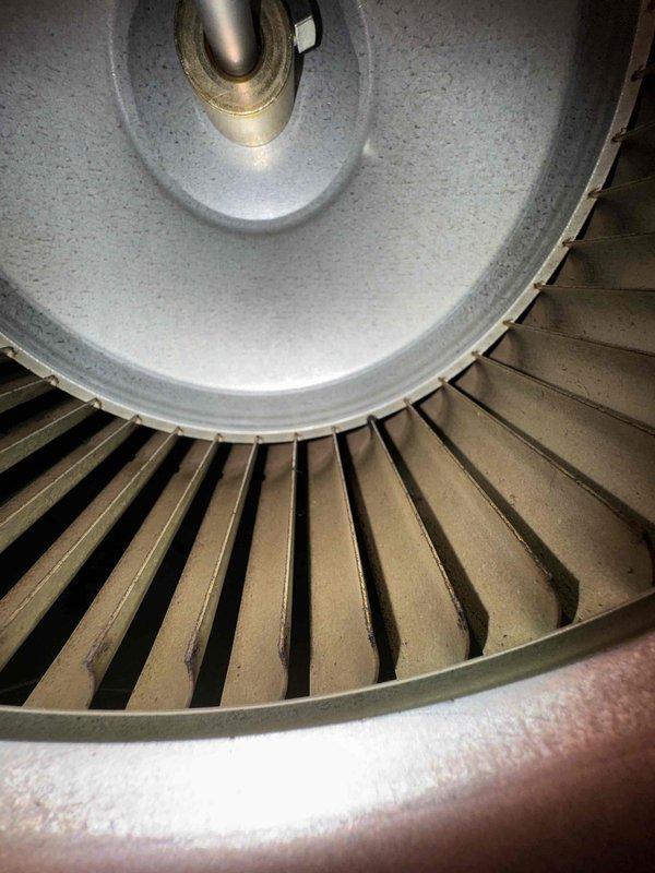 Performed routine heating system maintenance inspection. Examined blower wheel assembly for cleanliness and proper operation. Conducted CO measurements with readings of 19.3 PPM at the Premie air quality monitor, confirming system is operating within acceptable parameters.