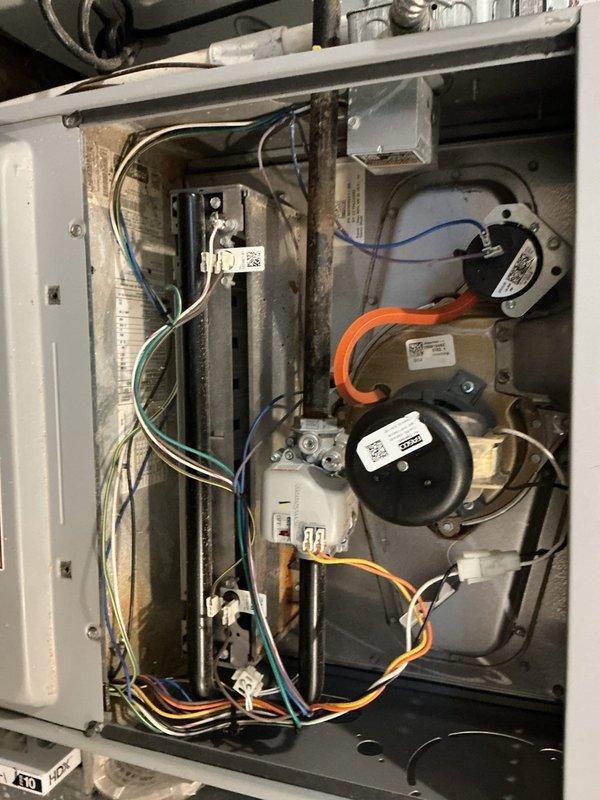 Performed routine furnace maintenance including inspection of internal components, electrical connections, and ductwork. System showed normal dust accumulation and wear; cleaned accessible components and verified proper operation of pressure switches, circuit board, and draft inducer motor. Service rescheduled as requested.