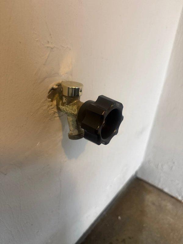 Replaced severely corroded exterior hose bibb with new brass fixture. Removed old valve showing significant mineral buildup and water damage to surrounding wall. Installed new shutoff valve with proper sealing to prevent future leakage and wall damage.