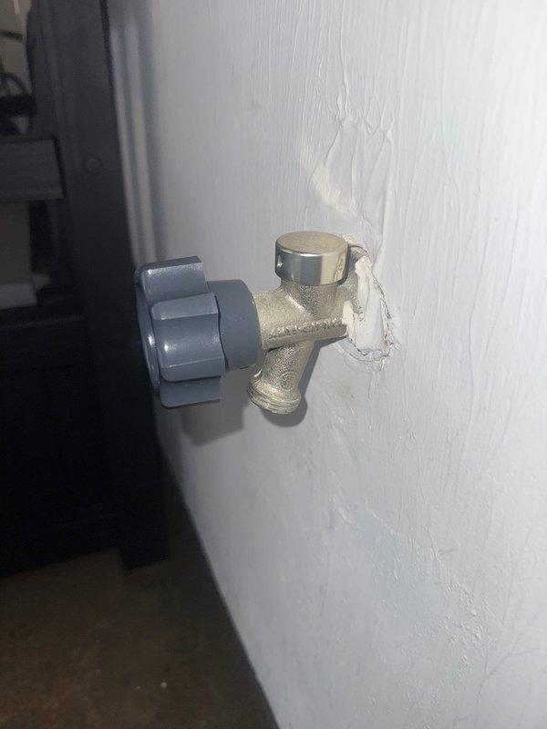 Replaced severely corroded exterior hose bibb with new brass fixture. Removed old valve showing significant mineral buildup and water damage to surrounding wall. Installed new shutoff valve with proper sealing to prevent future leakage and wall damage.