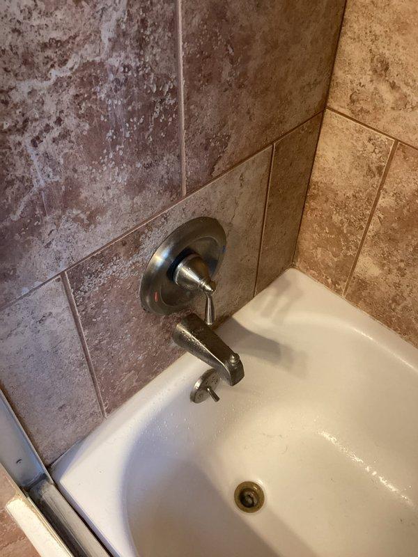 Conducted comprehensive inspection of bathroom plumbing system, examining bathtub fixtures and wall-mounted faucet assembly. Evaluated condition of galvanized metal supply pipes with particular attention to valve connections and potential oxidation points. No immediate issues requiring repair were identified during this preventative maintenance service.