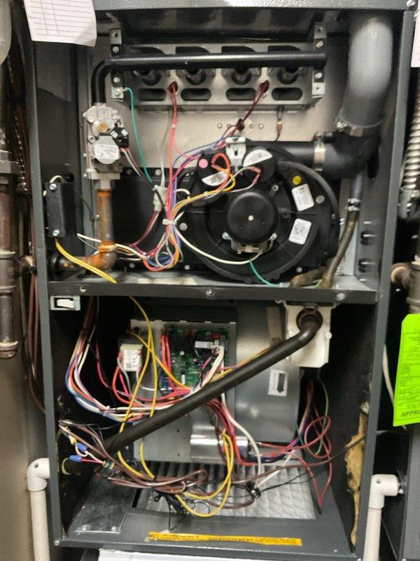 Completed scheduled maintenance on dual heating systems. Replaced filters in both furnaces and addressed the stripped screw on one furnace's access panel by cutting it off and installing a new fastener. Inspected and tested all components including blower motors, control boards, gas valve assemblies, and electrical connections to ensure proper operation of both heating systems.