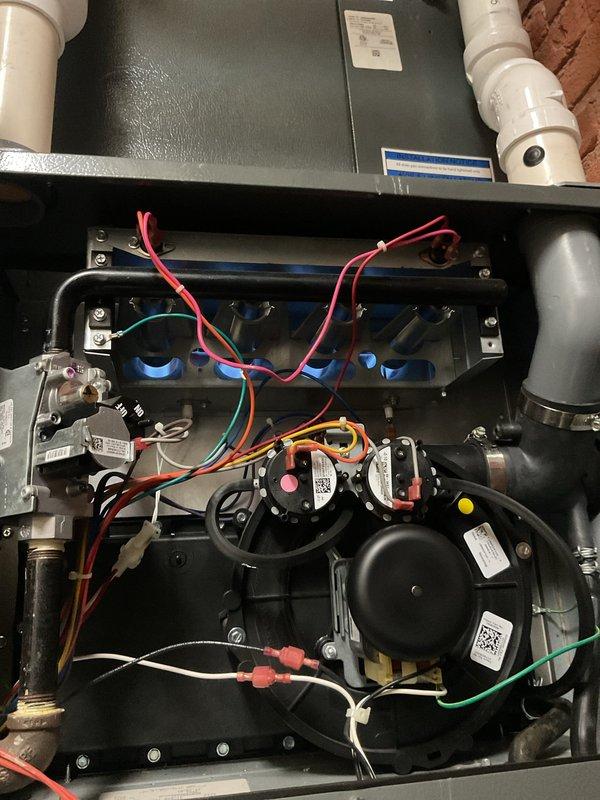Completed scheduled maintenance on dual heating systems. Replaced filters in both furnaces and addressed the stripped screw on one furnace's access panel by cutting it off and installing a new fastener. Inspected and tested all components including blower motors, control boards, gas valve assemblies, and electrical connections to ensure proper operation of both heating systems.