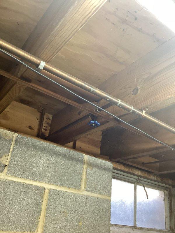 Responded to service call for non-functioning outdoor spigot. Inspected interior plumbing connections in basement, revealing copper supply line issues. Repaired connection to decorative duck-handled exterior faucet, restoring proper water flow and functionality.