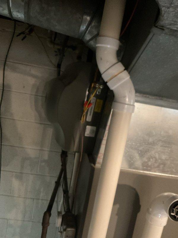 Completed monthly maintenance service on residential heating system. Inspected PVC venting system and checked all pipe connections for proper sealing. Accessed furnace interior to examine blower motor, verify electrical connections on control board, and ensure all wiring was secure and properly routed.