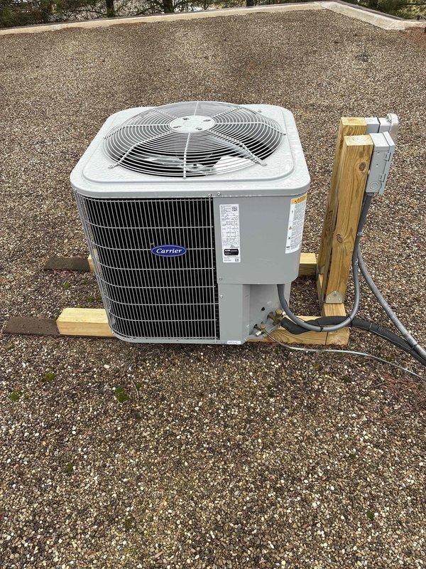 Conducted site evaluation of commercial HVAC system consisting of three rooftop forced air units requiring ladder access (approximately 10-12 feet high) and one floor unit. Documented equipment specifications and conditions of both the outdoor Carrier AC unit mounted on wooden supports with proper electrical connections and the indoor furnace/air handler with associated PVC drainage system for development of comprehensive commercial maintenance plan.