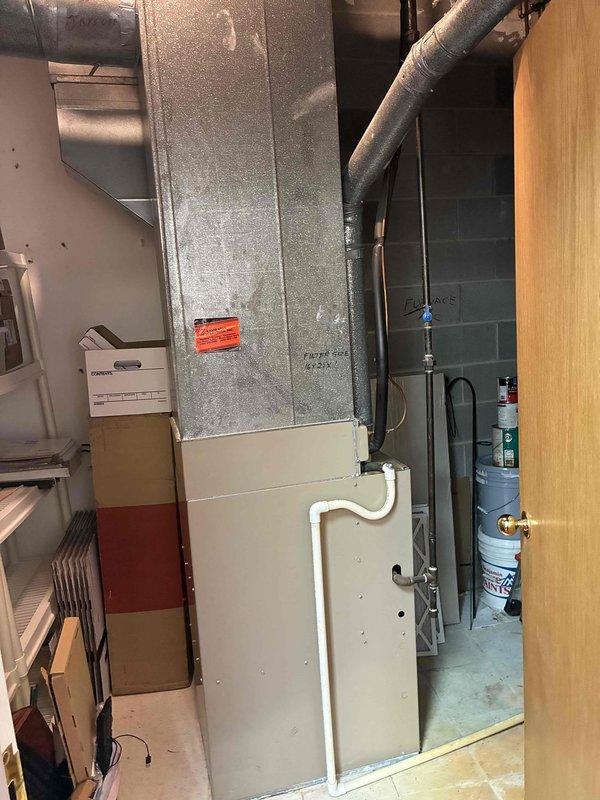 Conducted site evaluation of commercial HVAC system consisting of three rooftop forced air units requiring ladder access (approximately 10-12 feet high) and one floor unit. Documented equipment specifications and conditions of both the outdoor Carrier AC unit mounted on wooden supports with proper electrical connections and the indoor furnace/air handler with associated PVC drainage system for development of comprehensive commercial maintenance plan.