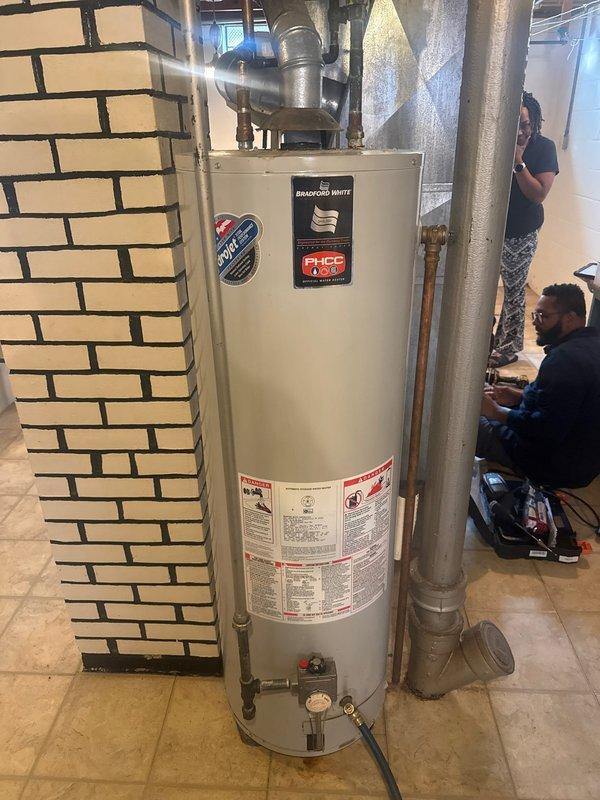 Conducted comprehensive inspection of residential water heater system and associated plumbing. Identified copper pipe deterioration with visible corrosion at connection point. Documented condition of main brass supply line and overall plumbing infrastructure for future reference.