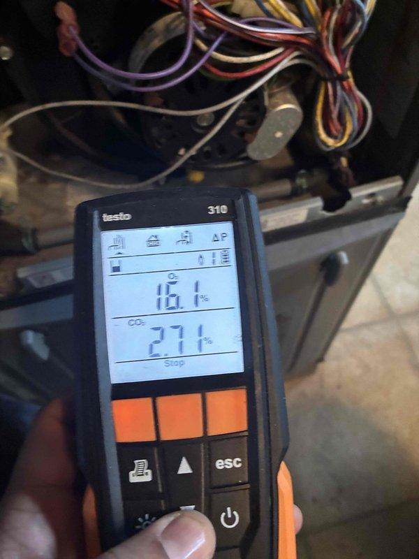 Conducted routine heating maintenance service. Inspected blower assembly and cleaned dust accumulation from fan blades and housing. Performed combustion analysis using Testo 310 analyzer, confirming CO2 levels at 27.1% and efficiency readings within acceptable parameters.