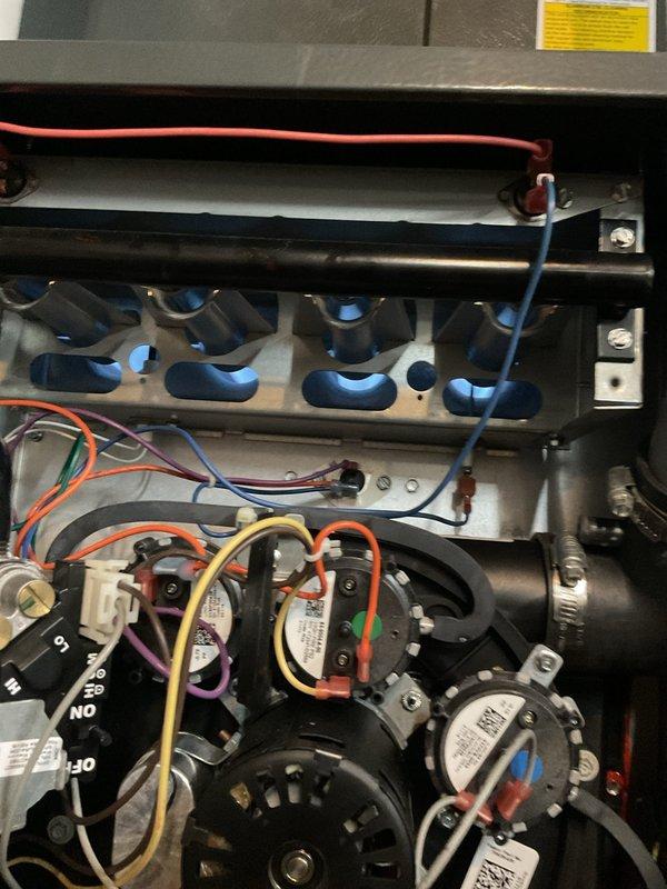 Responded to no heat complaint where furnace was not operating. Inspected internal components including blower assembly and heat exchanger. Examined control board with multiple wire connections and diagnosed faulty circuit board as the cause of heating failure. Replaced control board, verified proper operation of all systems, and restored heating functionality.