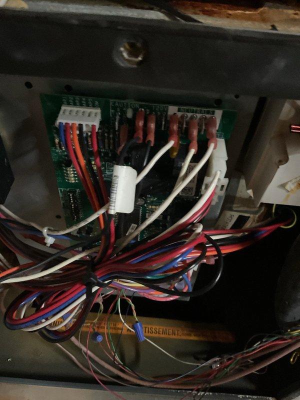 Responded to no heat complaint where furnace was not operating. Inspected internal components including blower assembly and heat exchanger. Examined control board with multiple wire connections and diagnosed faulty circuit board as the cause of heating failure. Replaced control board, verified proper operation of all systems, and restored heating functionality.